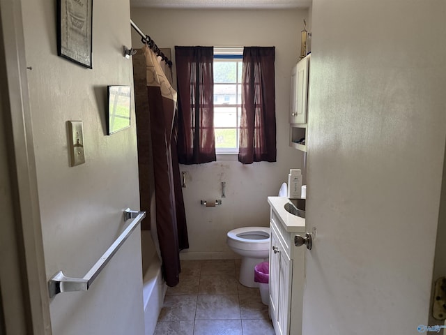 504 Joseph T Robinson, Gadsden, AL 35901 - bathroom with tile patterned floors, vanity, baseboards, and toilet