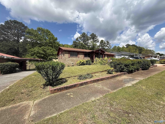 504 Joseph T Robinson, Gadsden, AL 35901 - ranch-style home featuring a front yard and concrete driveway