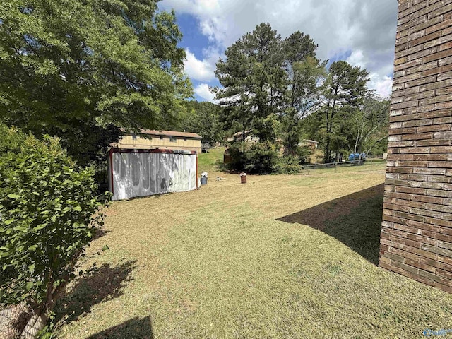 504 Joseph T Robinson, Gadsden, AL 35901 - view of yard with fence, an outbuilding, and a storage unit