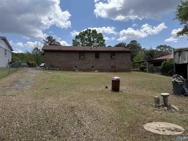 504 Joseph T Robinson, Gadsden, AL 35901 - rear view of property with brick siding, crawl space, fence, and a lawn