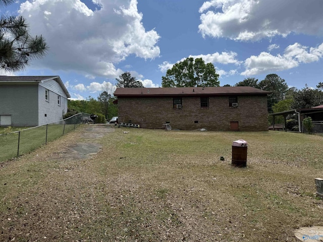 504 Joseph T Robinson, Gadsden, AL 35901 - back of house featuring brick siding, fence, a yard, and crawl space