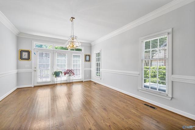 2600 SE Calumet Dr SE, Brownsboro, AL 35741 - unfurnished dining area with a chandelier, plenty of natural light, wood finished floors, baseboards, and crown molding