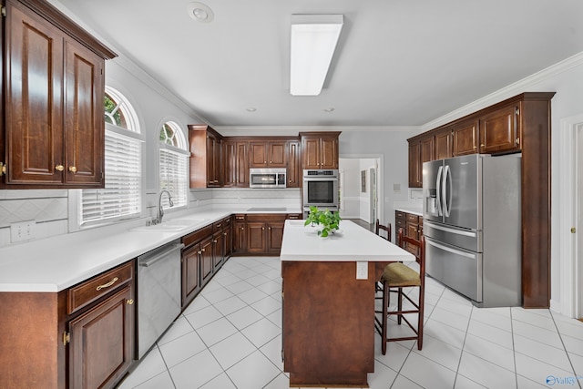 2600 SE Calumet Dr SE, Brownsboro, AL 35741 - kitchen featuring stainless steel appliances, a sink, a kitchen breakfast bar, a center island, and backsplash
