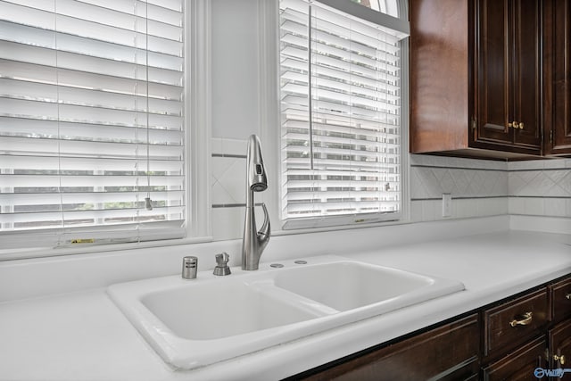 2600 SE Calumet Dr SE, Brownsboro, AL 35741 - kitchen featuring a sink, light countertops, healthy amount of natural light, and dark brown cabinetry