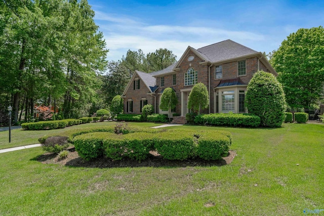 2600 SE Calumet Dr SE, Brownsboro, AL 35741 - colonial house with brick siding and a front lawn