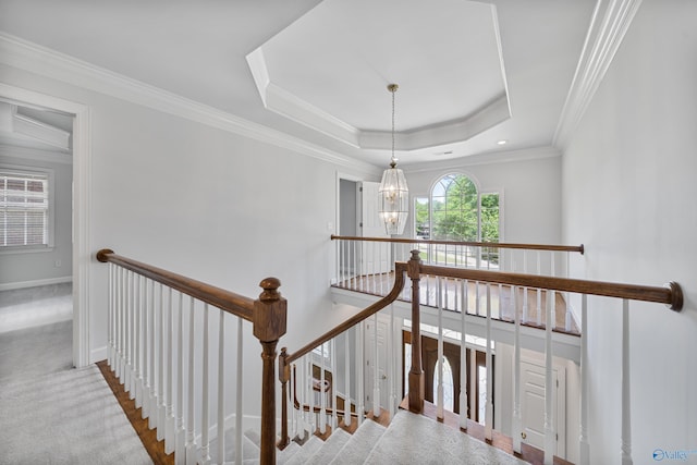 2600 SE Calumet Dr SE, Brownsboro, AL 35741 - hall with an upstairs landing, carpet flooring, a chandelier, a raised ceiling, and crown molding