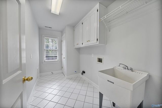 2600 SE Calumet Dr SE, Brownsboro, AL 35741 - laundry room with cabinet space, hookup for a washing machine, light tile patterned floors, and baseboards