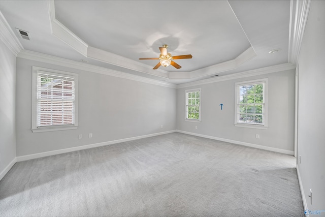 2600 SE Calumet Dr SE, Brownsboro, AL 35741 - carpeted empty room featuring a raised ceiling, ornamental molding, ceiling fan, and baseboards