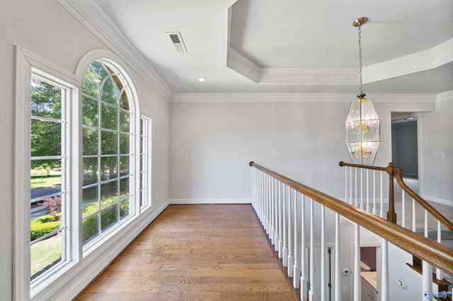 2600 SE Calumet Dr SE, Brownsboro, AL 35741 - hall with a chandelier, wood finished floors, baseboards, and ornamental molding
