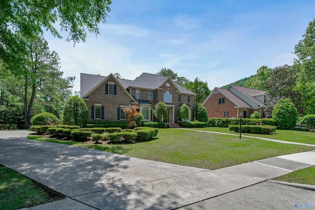 2600 SE Calumet Dr SE, Brownsboro, AL 35741 - view of front of property featuring a front yard and brick siding