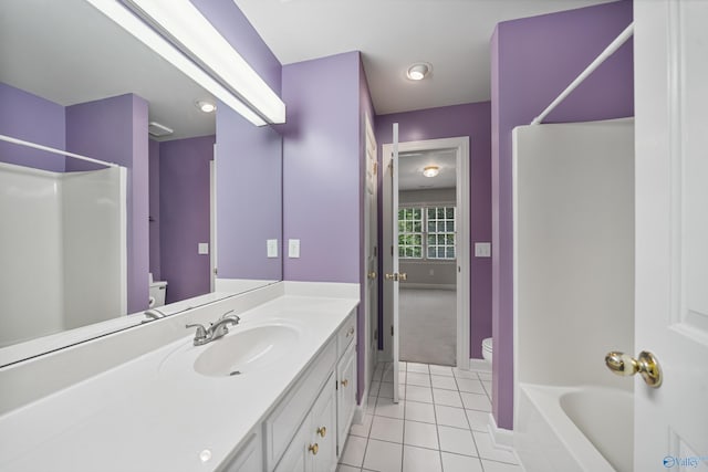 2600 SE Calumet Dr SE, Brownsboro, AL 35741 - bathroom with toilet, tile patterned flooring, vanity, baseboards, and washtub / shower combination