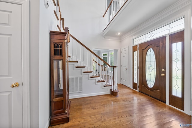 2600 SE Calumet Dr SE, Brownsboro, AL 35741 - foyer featuring wood finished floors, ornamental molding, stairs, and baseboards