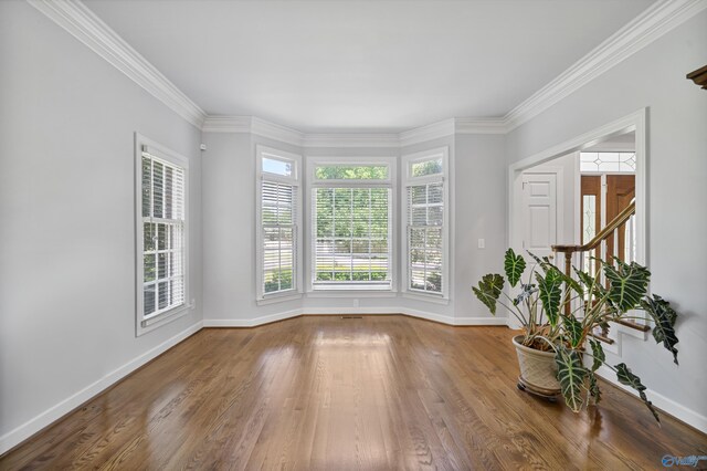 2600 SE Calumet Dr SE, Brownsboro, AL 35741 - unfurnished room featuring wood finished floors, baseboards, ornamental molding, and stairs