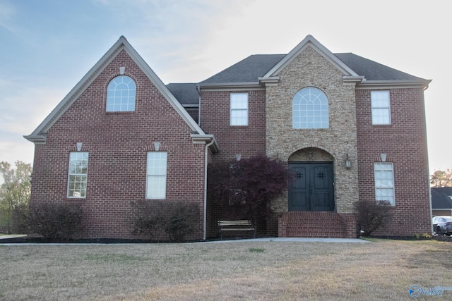 front facade with a front yard