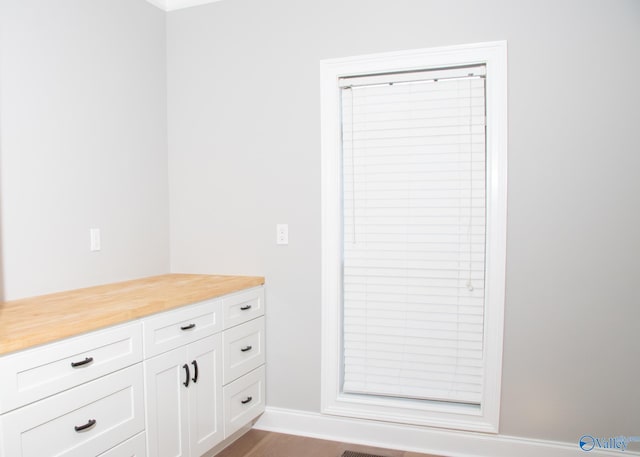 bathroom featuring vanity and wood-type flooring