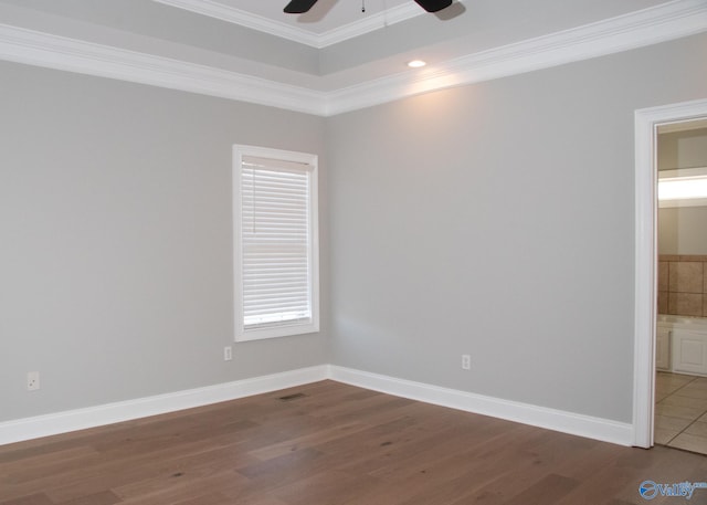 empty room featuring ornamental molding, tile patterned floors, and ceiling fan