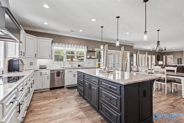 kitchen featuring recessed lighting, wall chimney exhaust hood, black electric cooktop, white cabinets, and dishwasher
