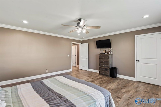 bedroom with baseboards, ornamental molding, wood finished floors, and recessed lighting