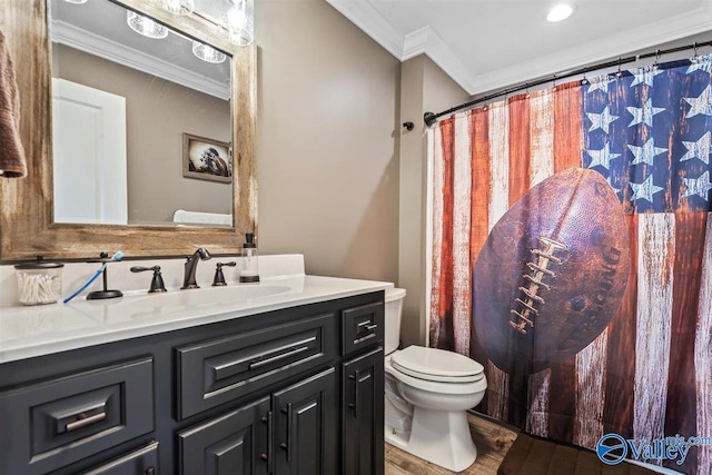 bathroom with wood finished floors, curtained shower, vanity, toilet, and ornamental molding