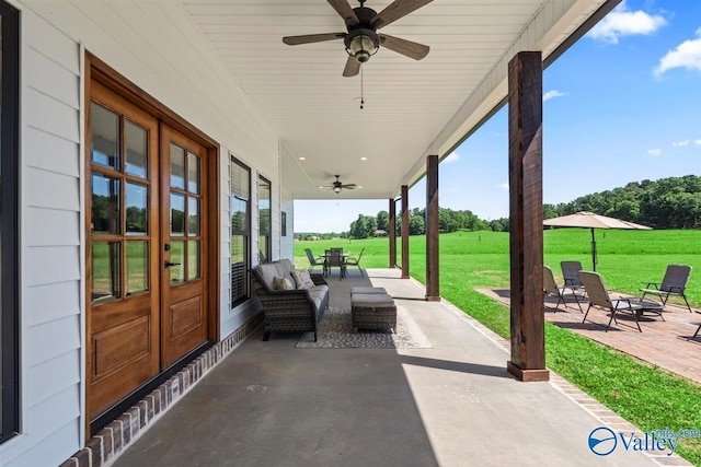 view of patio / terrace with ceiling fan and french doors
