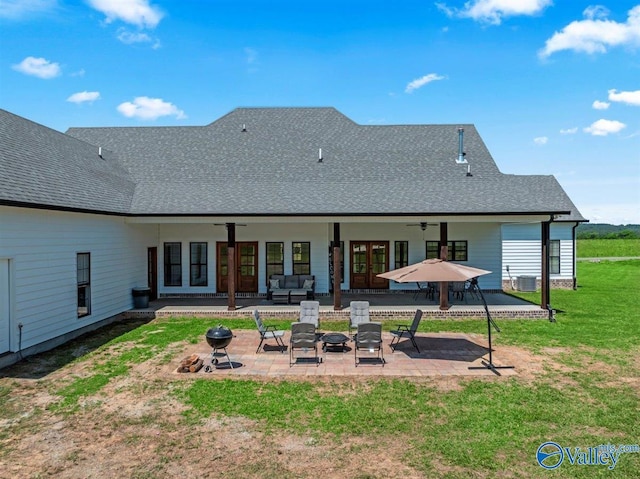 back of house with ceiling fan, central AC, a patio, an outdoor hangout area, and a yard