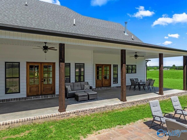 rear view of house featuring ceiling fan, french doors, roof with shingles, a patio area, and an outdoor hangout area