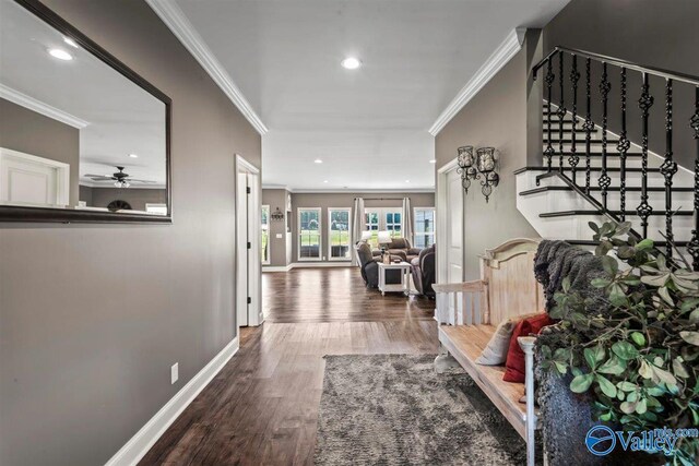 hall featuring stairs, recessed lighting, ornamental molding, and wood finished floors