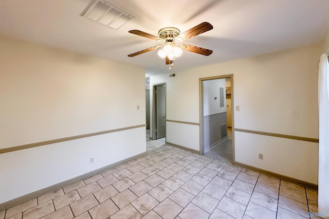 unfurnished room featuring ceiling fan and light tile patterned floors