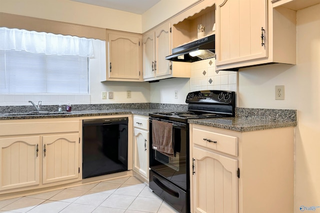 kitchen with tasteful backsplash, sink, dark stone countertops, light tile patterned floors, and black appliances