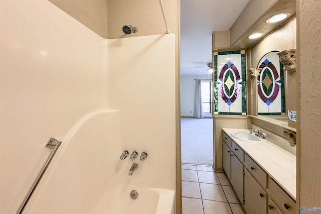 bathroom featuring vanity, tile patterned floors, and shower / bathing tub combination