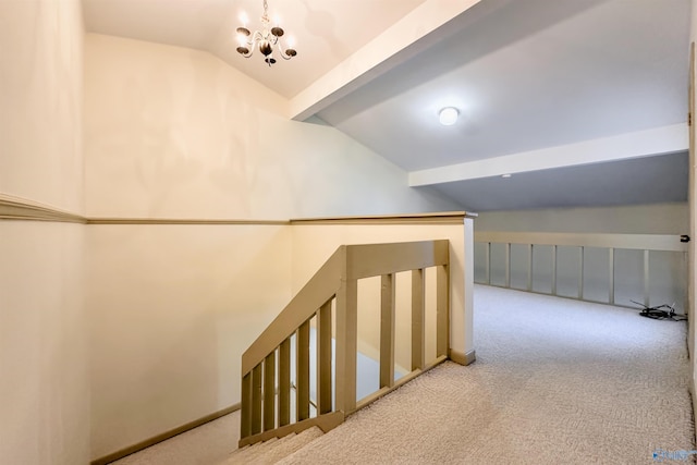 hall featuring vaulted ceiling with beams, light colored carpet, and a chandelier