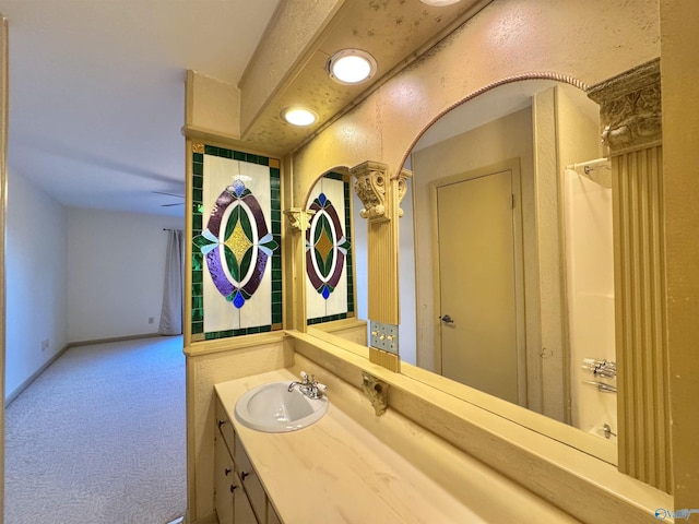 bathroom with walk in shower and vanity