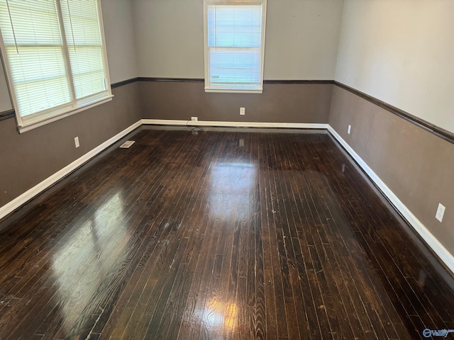 unfurnished room featuring hardwood / wood-style floors