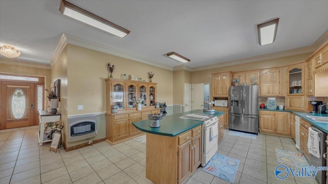kitchen featuring heating unit, light tile patterned flooring, ornamental molding, appliances with stainless steel finishes, and a center island