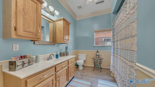 full bath featuring visible vents, toilet, ornamental molding, wood finished floors, and vanity