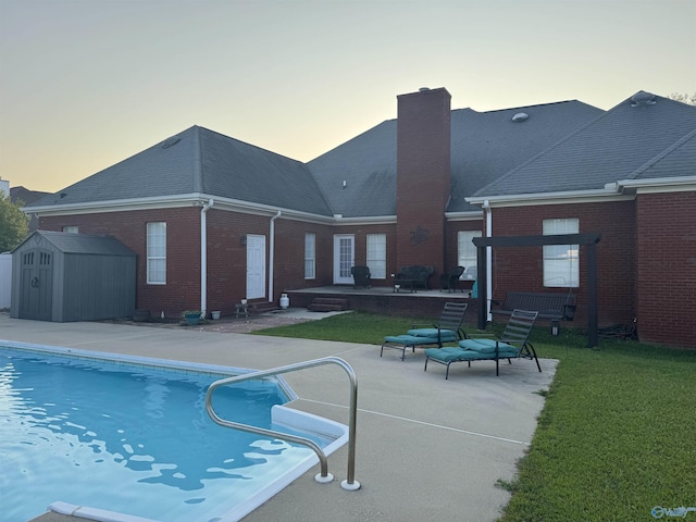 2032 Red Oak Ln NE, Arab, AL 35016 - swimming pool with a patio area, a storage unit, a yard, and entry steps