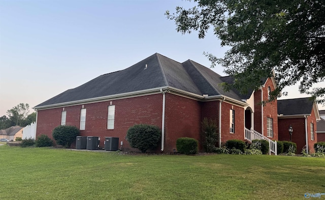 2032 Red Oak Ln NE, Arab, AL 35016 - view of property exterior featuring brick siding, a yard, and a shingled roof