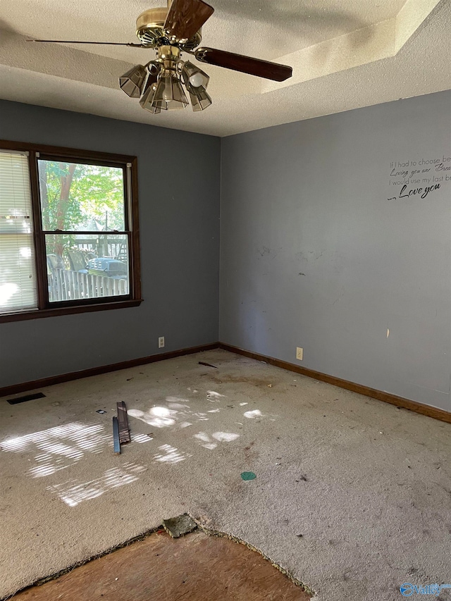 unfurnished room featuring a textured ceiling and ceiling fan