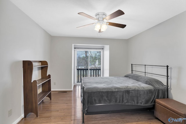 bedroom featuring ceiling fan, baseboards, access to outside, and wood finished floors