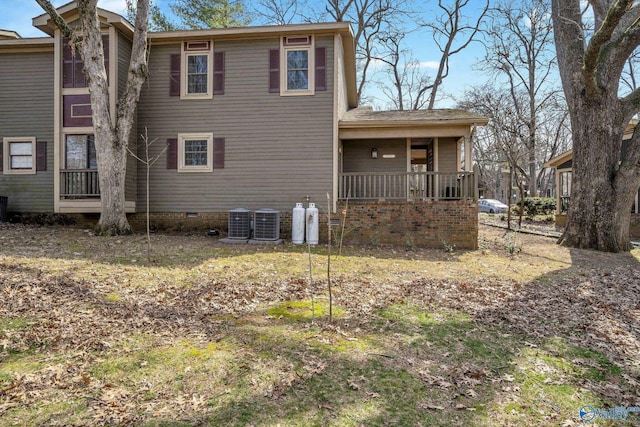 exterior space featuring cooling unit, crawl space, and covered porch