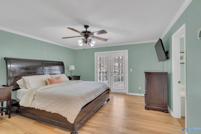 bedroom with access to exterior, french doors, crown molding, and light wood-style flooring