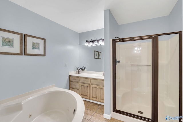 bathroom featuring a stall shower, vanity, a whirlpool tub, and tile patterned floors