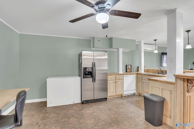 kitchen with dishwasher, light countertops, stainless steel fridge, and decorative light fixtures