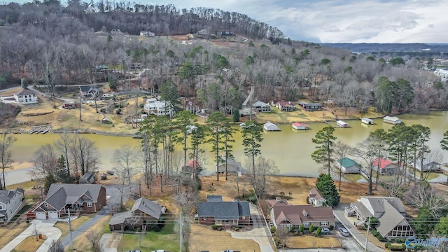 birds eye view of property with a water view and a residential view