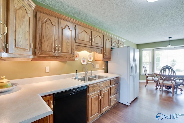 24430 Chadwick Dr, Athens, AL 35613 - kitchen with dishwasher, a textured ceiling, white refrigerator with ice dispenser, light wood finished floors, and light countertops