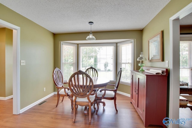 24430 Chadwick Dr, Athens, AL 35613 - dining area featuring a textured ceiling and light wood-style flooring