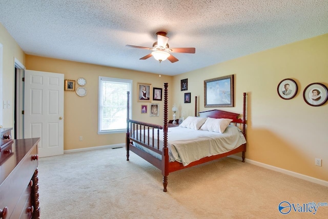 24430 Chadwick Dr, Athens, AL 35613 - bedroom featuring light colored carpet, a ceiling fan, and a textured ceiling