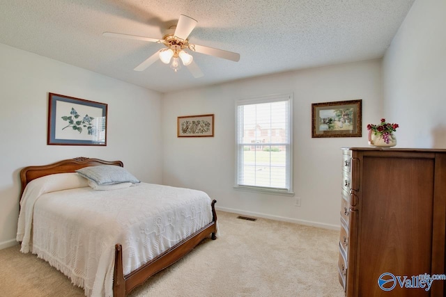 24430 Chadwick Dr, Athens, AL 35613 - bedroom featuring light carpet, a textured ceiling, and a ceiling fan