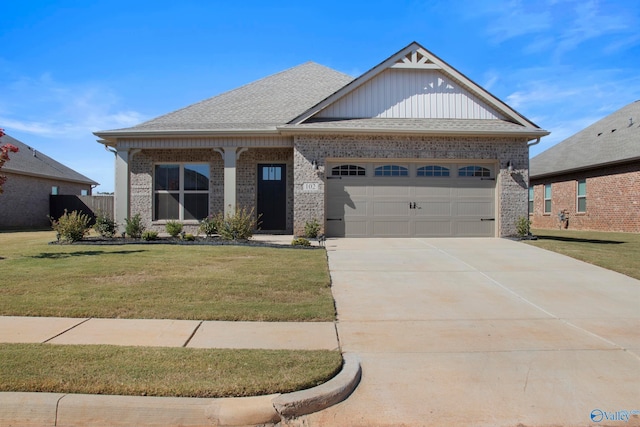 view of front of home featuring a garage and a front lawn