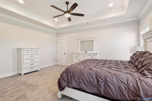 bedroom with ceiling fan, a raised ceiling, wooden ceiling, ornamental molding, and light colored carpet